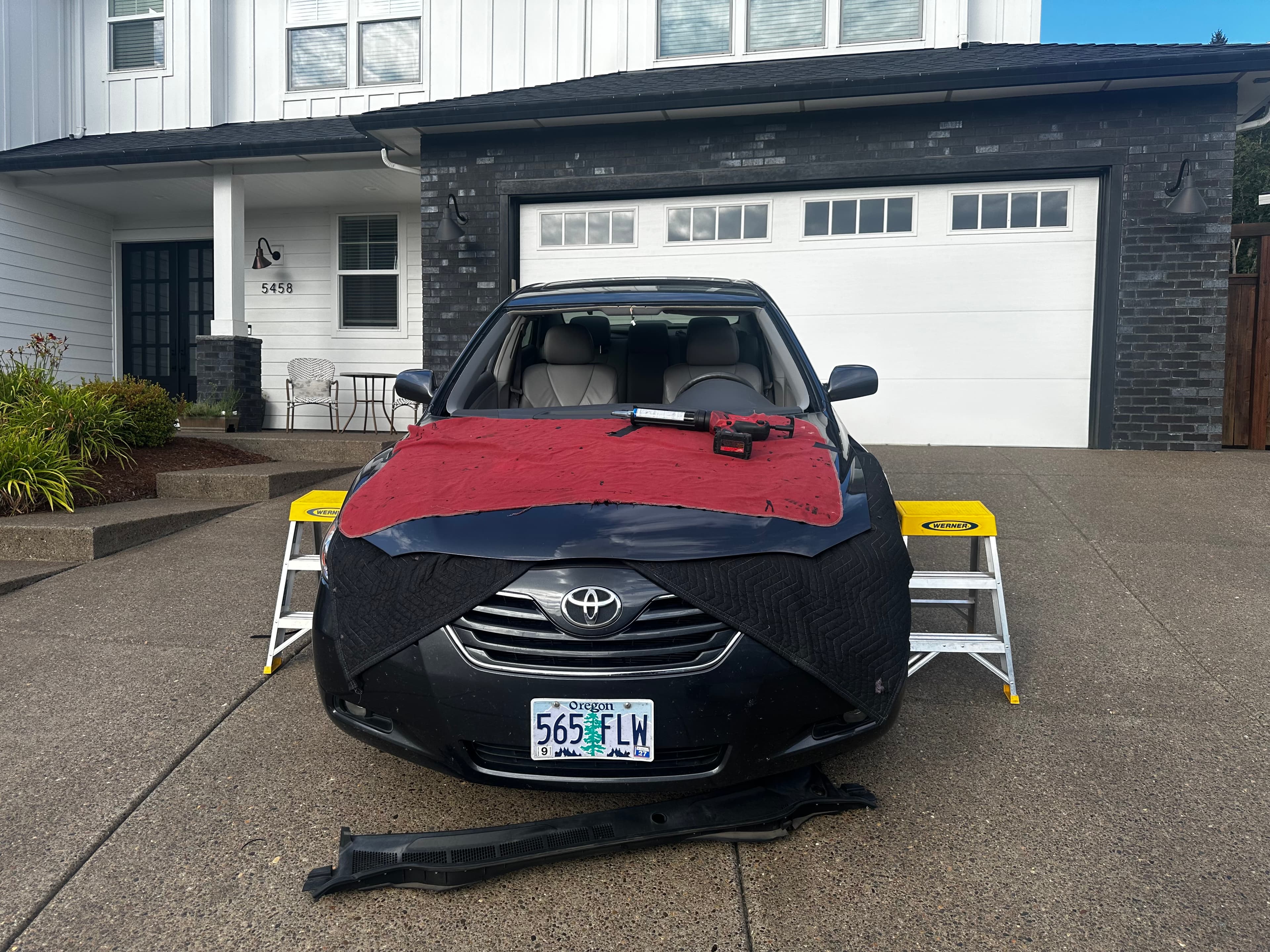 Windshield moldings and wiper cowl removed ready for extraction
